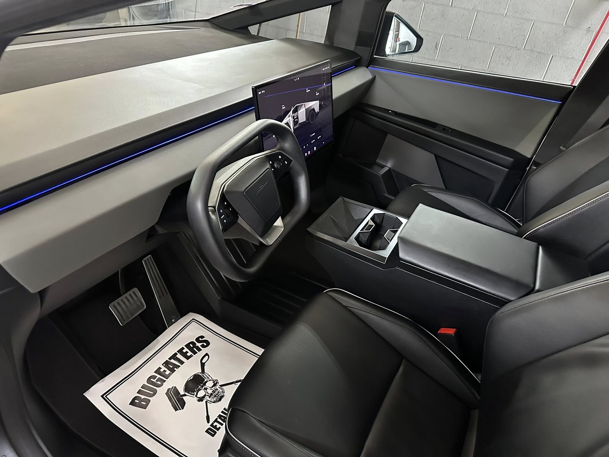 Tesla Cybertruck interior detailed by Bugeaters Detail and Wash showing pristine dashboard and branded floor mat